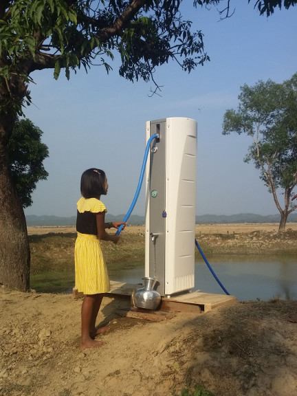 Hand-powered Villagepump at a riverbank